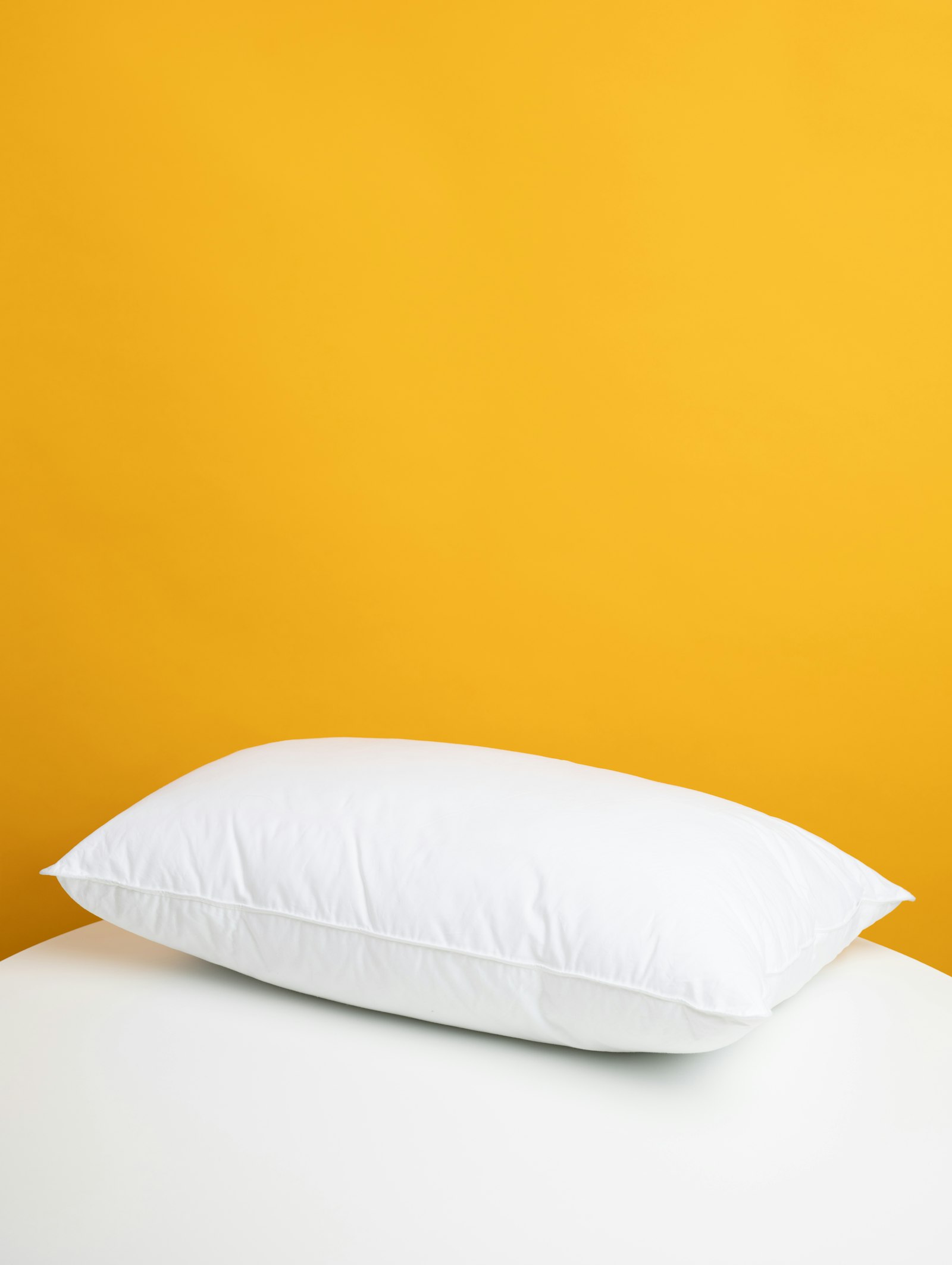 White cotton bedding set on a made bed